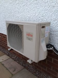 Close up shot of external unit of Fujitsu R410A air to air heat pump