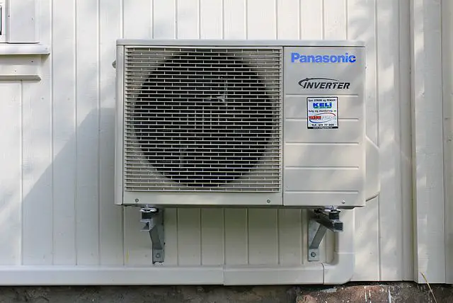 Panasonic Air Source Heat Pump mounted on the side of a building